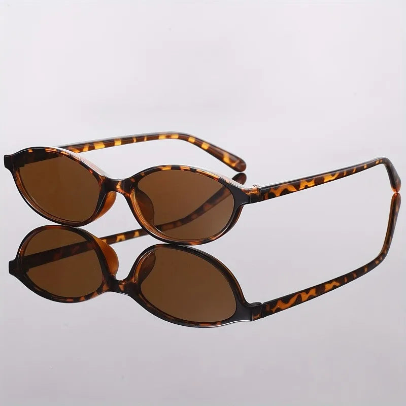 1pcs Minimalist black-rim oval sunglasses, sun protection, fits all face shapes for daily commute.